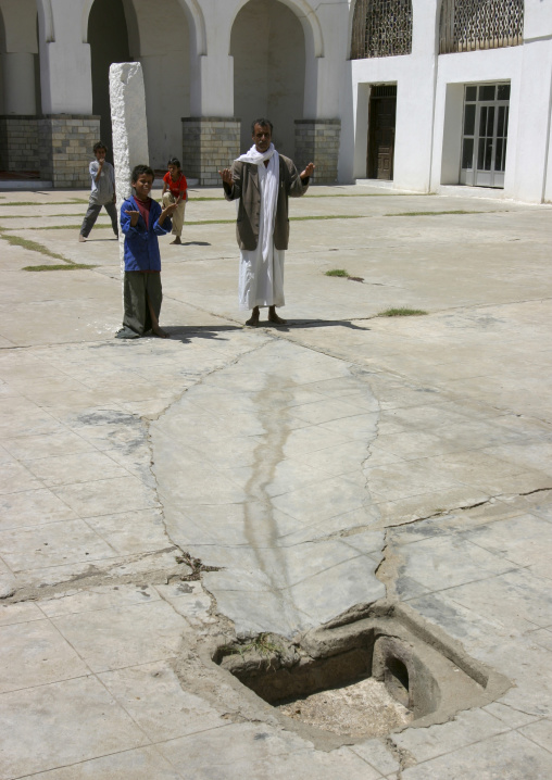 Yemeni people praying in a mosque courtyrad, Janad Region, Taiz, Yemen