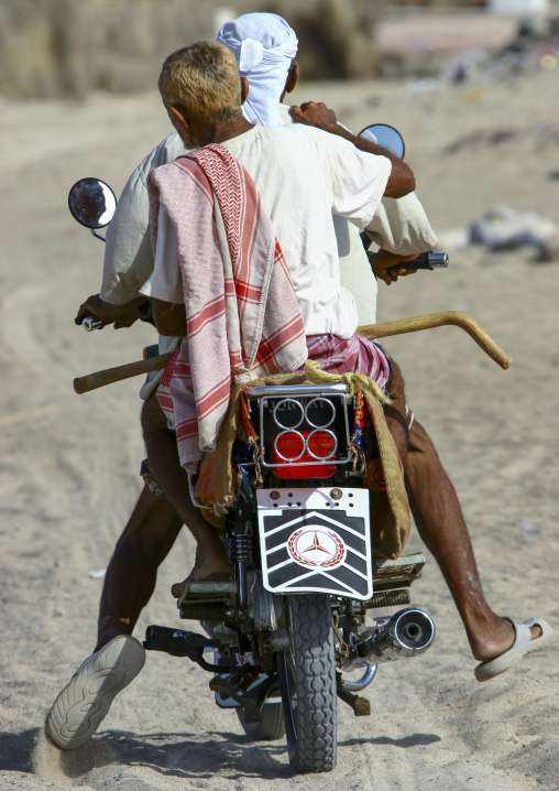 Yemeni men riding a motorbike, Taiz Governorate, Mokha, Yemen