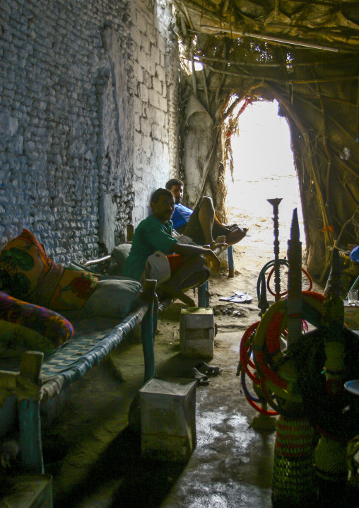 Yemeni men smoking shishas in a house, Al Hudaydah Governorate, Zabid, Yemen