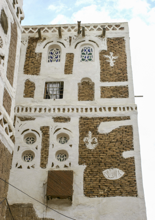 Traditional house in the old city featuring stained-glass windows, Amanat Al-Asemah, Sanaa, Yemen