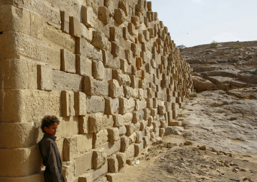 Yemeni boy in front of the dam at Wadi Adhana, Marib Governorate, Marib, Yemen