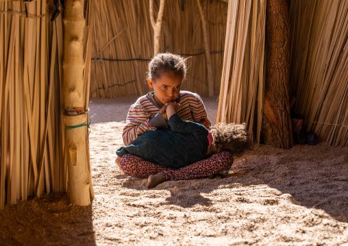 Tuareg girl with her little sister in a reed house, North Africa, Tamanrasset, Algeria