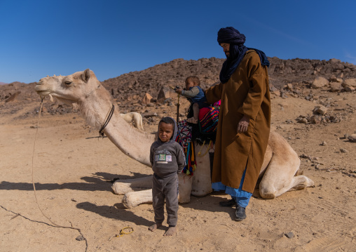 Tuareg man with his children riding a camel, North Africa, Tamanrasset, Algeria