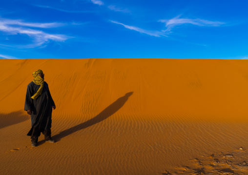 Tuareg in a sand dunes in the Sahara desert, Tassili N'Ajjer National Park, Tadrart Rouge, Algeria