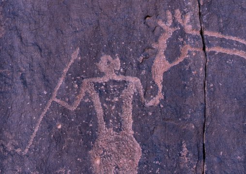 Rock carvings depicting a warrior with giraffes, Tassili N'Ajjer National Park, Tadrart Rouge, Algeria
