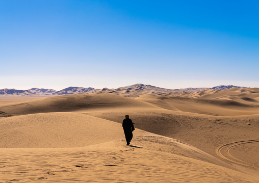 Tuareg in the sand dunes in Sahara desert, North Africa, Erg Admer, Algeria