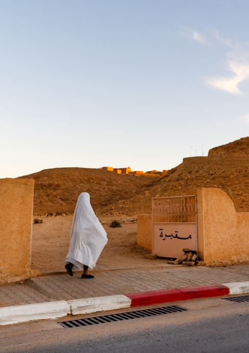 Algerian woman  in white haïk in the street, North Africa, Ghardaia, Algeria