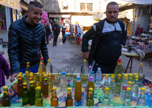 Men selling rose and orange water in Souk El Ghezel, North Africa, Constantine, Algeria