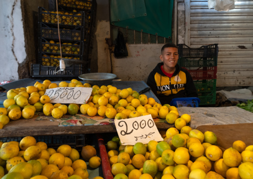 Boy selling lemons in Souk El Ghezel, North Africa, Constantine, Algeria