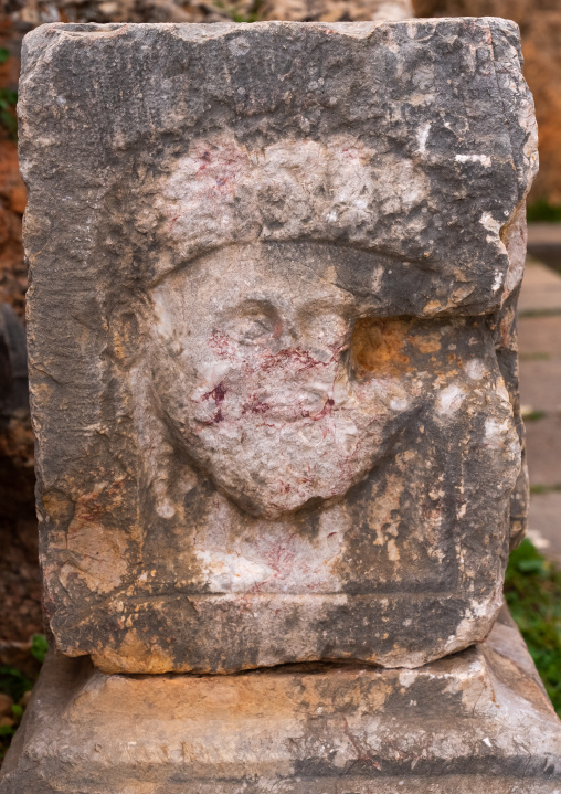 Head carved on a stone in Tiddis Roman Ruins, North Africa, Bni Hamden, Algeria