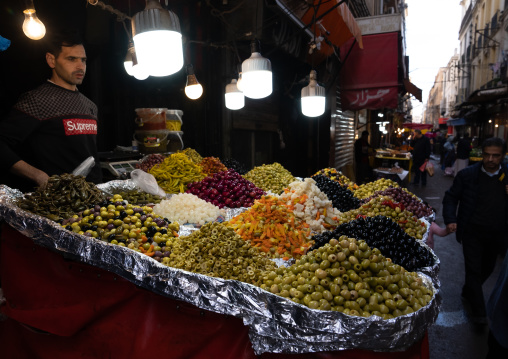 Olives seller in a market, North Africa, Oran, Algeria