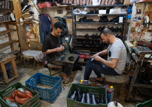 Men making shoes in a workshop in the casbah, North Africa, Algiers, Algeria