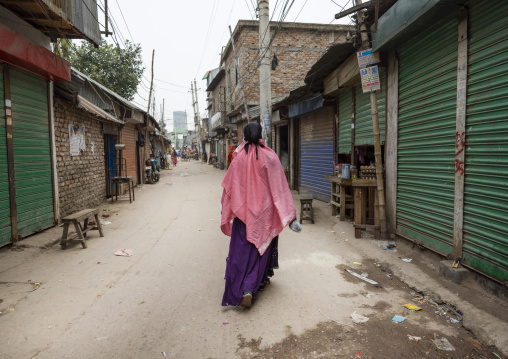 Rear view of a woman wearing burqa in Korail slum, Dhaka Division, Dhaka, Bangladesh