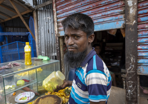 Portrait of a bangladeshi man selling food in the street, Dhaka Division, Dhaka, Bangladesh