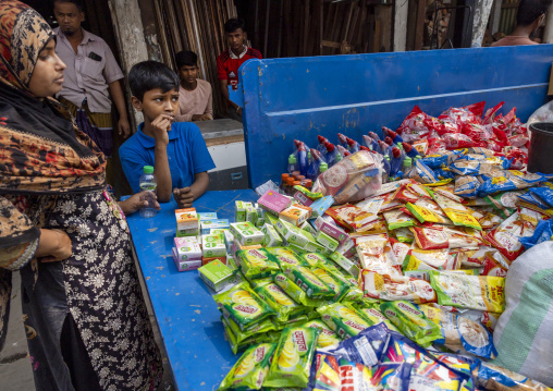 Bangladeshi people buying junk food sold at the back of a truck, Dhaka Division, Dhaka, Bangladesh