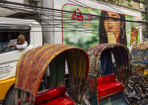 Truck with ice cream advertisement in front of a rickshaw, Dhaka Division, Dhaka, Bangladesh