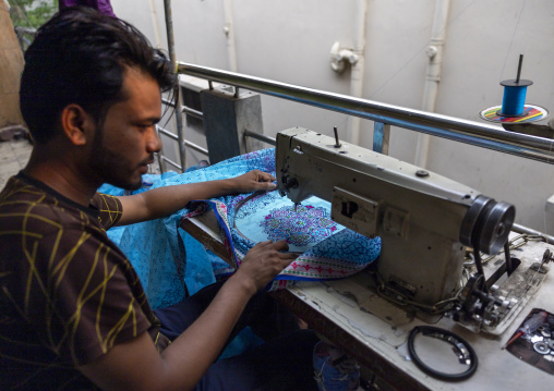 Bangladeshi man sewing embroidery, Dhaka Division, Dhaka, Bangladesh