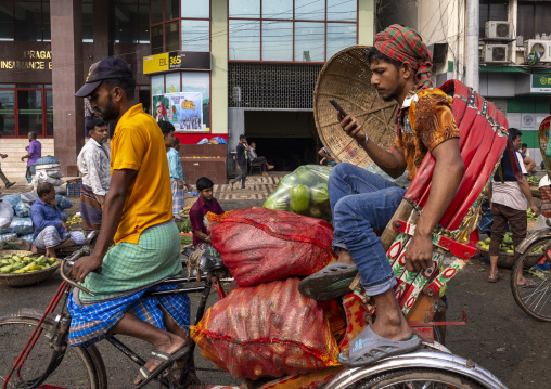 Bangladeshi man on a rickshaw at vegetables and fruits market, Dhaka Division, Dhaka, Bangladesh