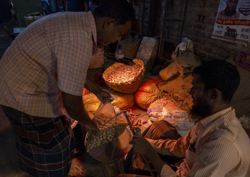 Bangladeshi man buying potatoes at vegetables and fruits morning market, Dhaka Division, Dhaka, Bangladesh