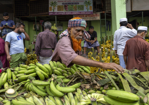 Bangladeshi man selling bananas at Kawran Bazar, Dhaka Division, Dhaka, Bangladesh