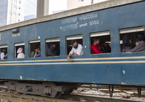 Passengers in a train passing in Kawran bazar, Dhaka Division, Dhaka, Bangladesh