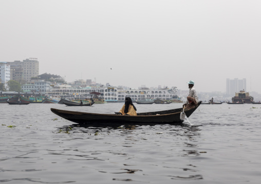 Bangladeshi woman in burqa on a local boat on Buriganga river, Dhaka Division, Keraniganj, Bangladesh