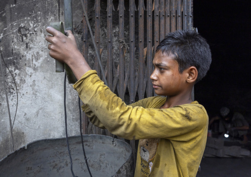 Bangladeshi boy working at Dhaka shipyard, Dhaka Division, Keraniganj, Bangladesh