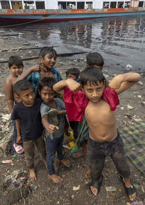 Bangladeshi grueur boys on a riverbank, Dhaka Division, Keraniganj, Bangladesh