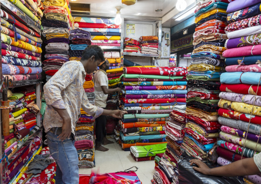 Bangladeshi men selling fabrics in a shop, Dhaka Division, Dhaka, Bangladesh