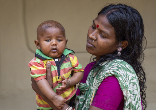 Portrait of a Santal tribe mother with her baby, Sylhet Division, Kamalganj, Bangladesh