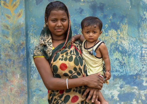 Portrait of a Santal tribe mother with her baby, Sylhet Division, Kamalganj, Bangladesh