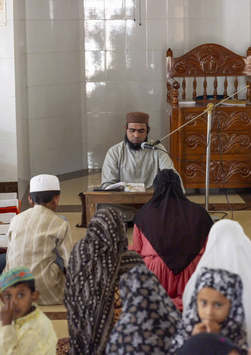 Bangladeshi children in a madrassa with the teacher, Sylhet Division, Kamalganj, Bangladesh