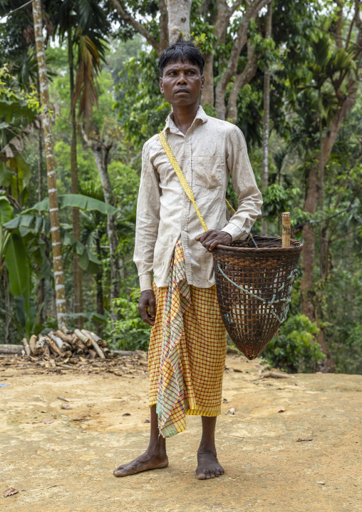 Portrait of a Khasi tribe man with a bamboo basket, Sylhet Division, Kamalganj, Bangladesh