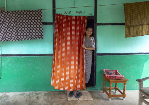 Khasi tribe woman at the entrance of her house, Sylhet Division, Kamalganj, Bangladesh