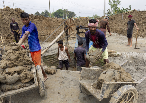 Workers digging clay in a brick factory, Sylhet Division, Bahubal, Bangladesh