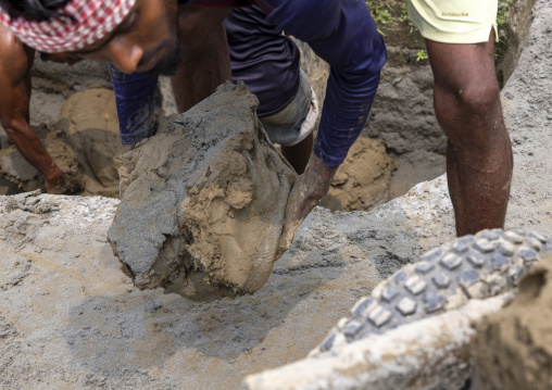 Workers digging clay in a brick factory, Sylhet Division, Bahubal, Bangladesh