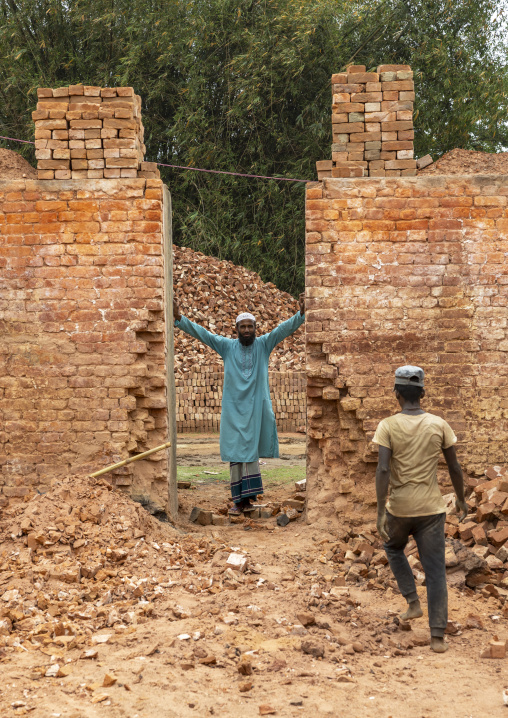 Onwer standing in the entrance of an oven of his brick factory, Sylhet Division, Bahubal, Bangladesh