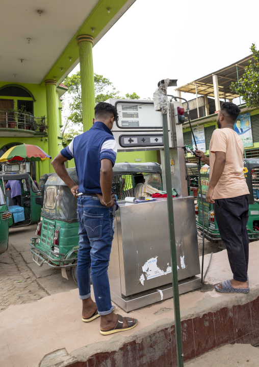 A car is fueled with compressed natural gas at a pump station, Chittagong Division, Ashuganj, Bangladesh