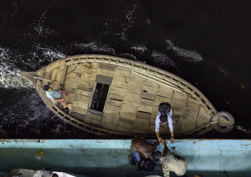 Late passengers reaching the ferry with local boat, Dhaka Division, Dhaka, Bangladesh