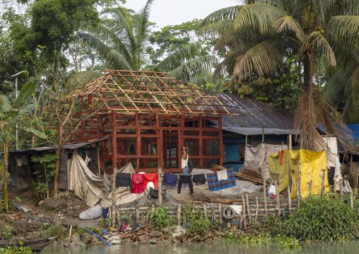 Carpenter building a house on a river bank in Sundarbans, Barisal Division, Banaripara, Bangladesh