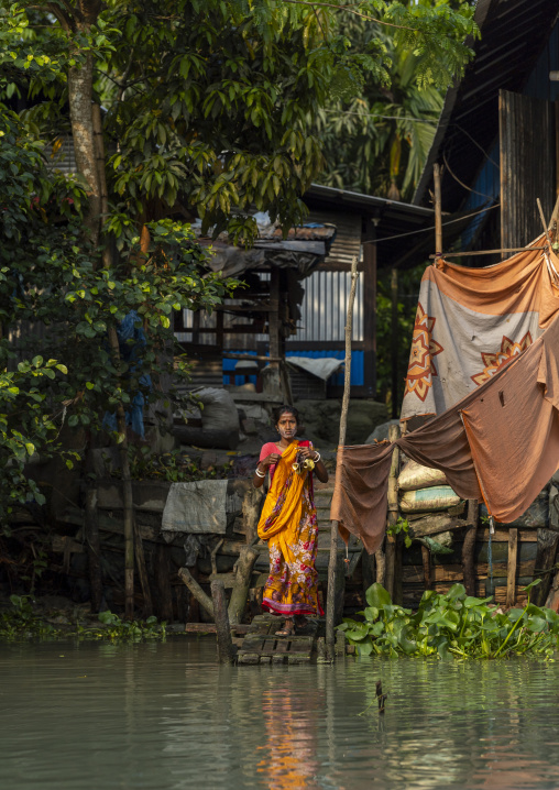 Bangladeshi woman washing in the river in Sundarbans, Barisal Division, Banaripara, Bangladesh