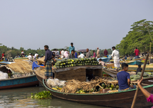 Bangladeshi men selling fruits and vegetables at weekly floating market, Barisal Division, Harta, Bangladesh