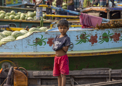 Boy in the fruits and vegetables at weekly floating market, Barisal Division, Harta, Bangladesh