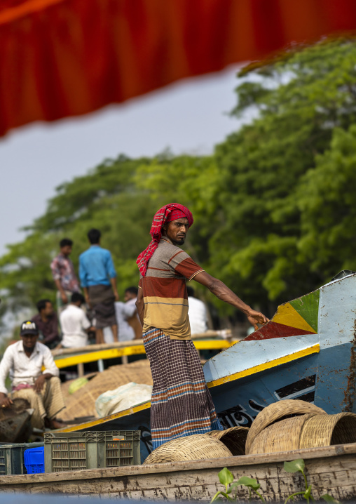 Bangladeshi men selling fruits and vegetables at weekly floating market, Barisal Division, Harta, Bangladesh