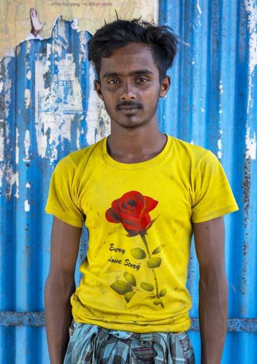 Portrait of a bangladeshi man wearing a yellow shirt with a rose, Barisal Division, Harta, Bangladesh