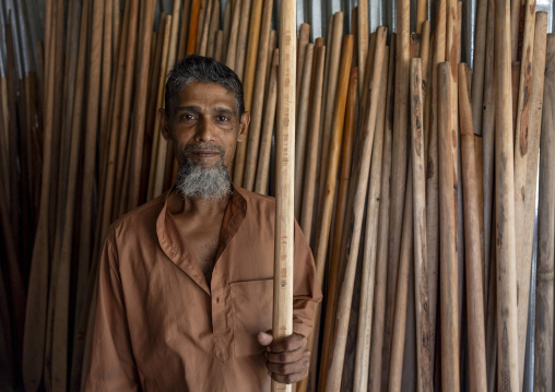 Portrait of a bangladeshi man selling wooden oars in Sundarbans, Barisal Division, Harta, Bangladesh