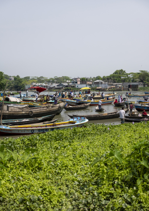 Bangladeshi men selling fruits and vegetables at weekly floating market, Barisal Division, Harta, Bangladesh