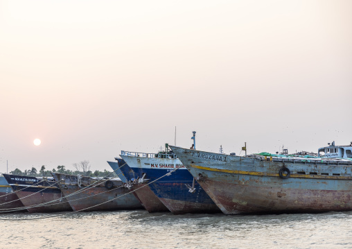 Anchored fishing trawlers at sunset, Khulna Division, Dacope, Bangladesh