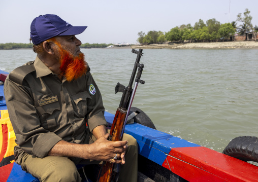 Ranger with a gun to pretect from the tigers in the Sundarbans, Khulna Division, Shyamnagar, Bangladesh