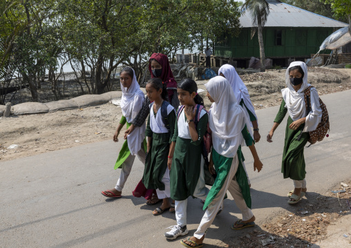 Bangladeshi muslim girls in school uniforms walking in the street, Khulna Division, Shyamnagar, Bangladesh